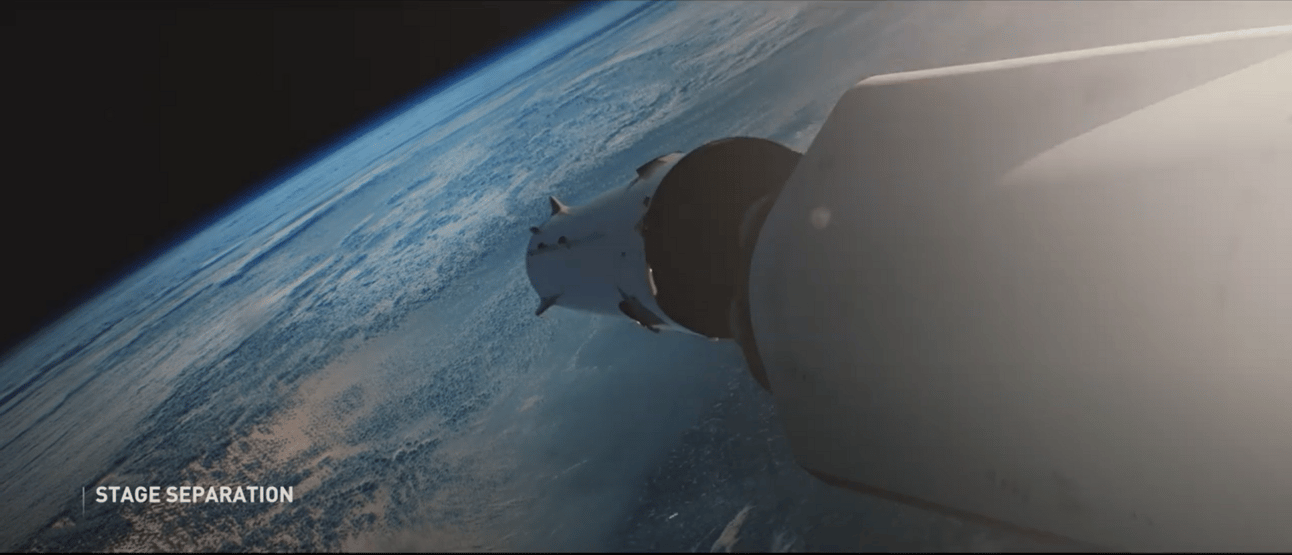 Starship's first stage booster separates from the upper stage high above Earth's curved horizon, with the blue atmosphere and cloud formations visible below. Text overlay reads "STAGE SEPARATION" in the lower left corner.